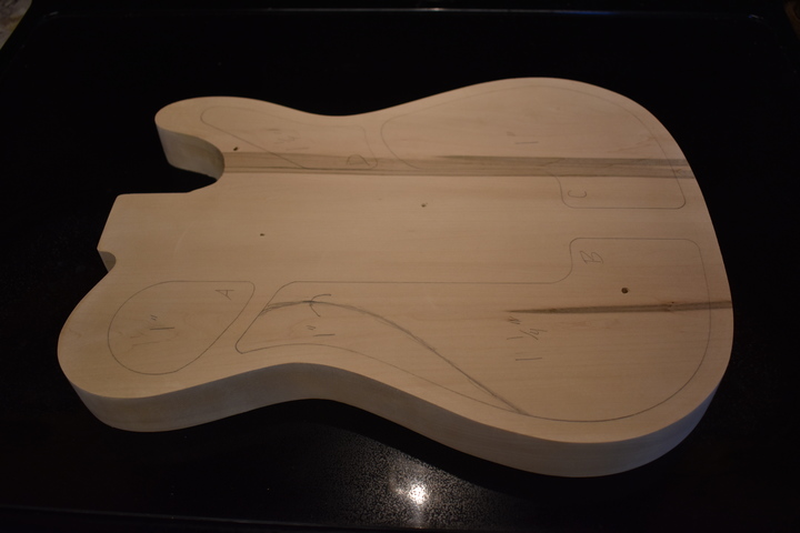 Body blank routed to shape after planing