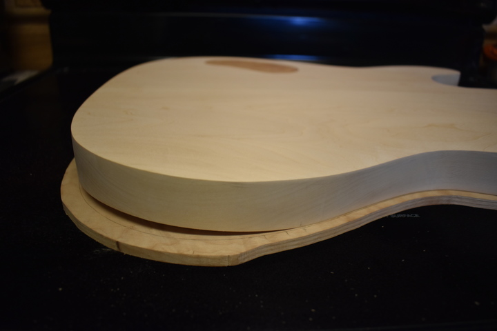 Top and body
                glued, showing arm cut gap