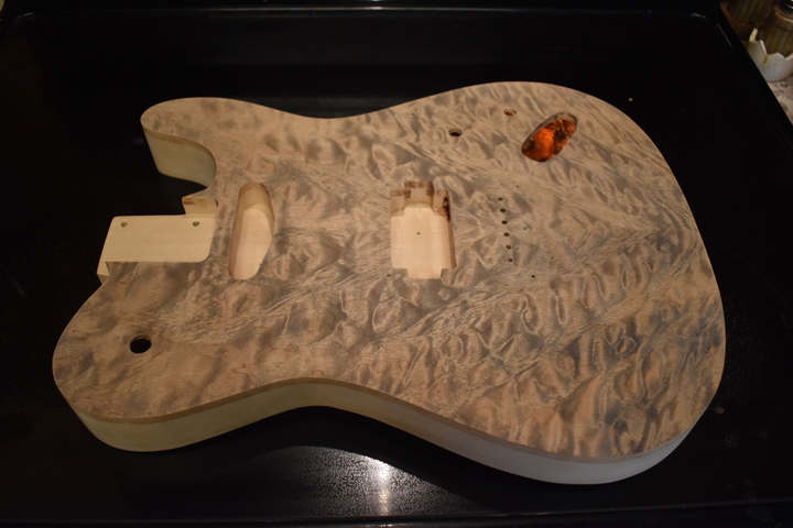 Top with
                pickup cavities and jack hole routed