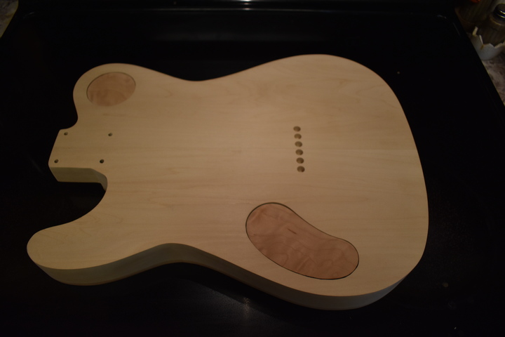 Back with string retainer grommet holes drilled
